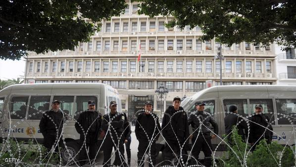Tunisian police officers stand guard in