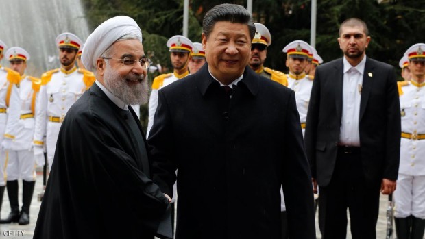 الرئيس الإيراني حسن روحاني ونظيره الصيني الزائر شي جين بينغ