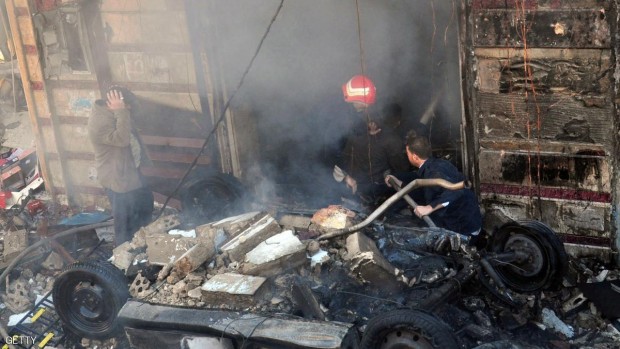 من تفجير سابق بواسطة سيارة مفخخة في حي الزهراء بحمص