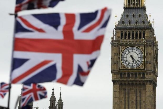Flags are seen above a souvenir kiosk near Big Ben clock at the Houses of Parliament in central London